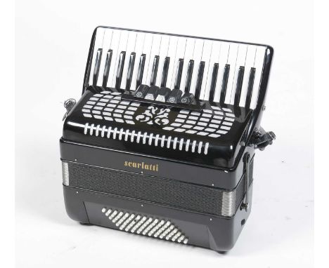 A Scarlatti 72 bass piano accordion, with five tone selectors, strap and hard case.