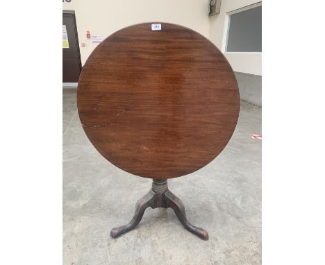 A George III mahogany tripod table, the one piece snap-top on baluster column with birdcage. 30½' diam.