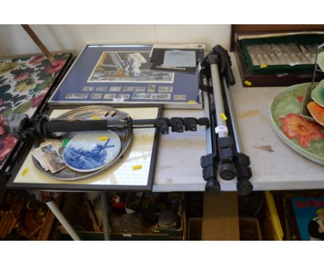 A camera tripod; a camera monopod; old photos; coinage etc