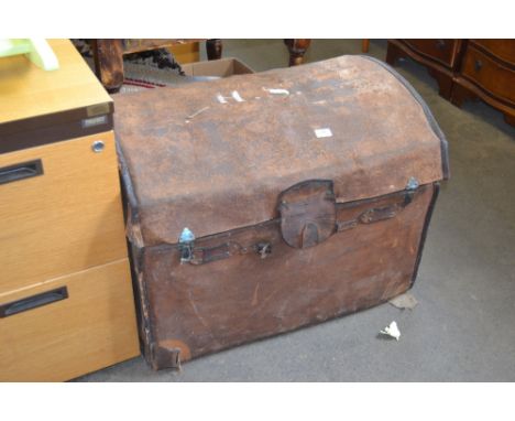 A canvas and leather dome topped trunk 