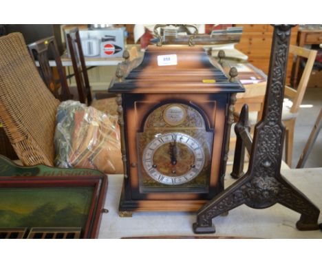 A modern three hole mantel clock