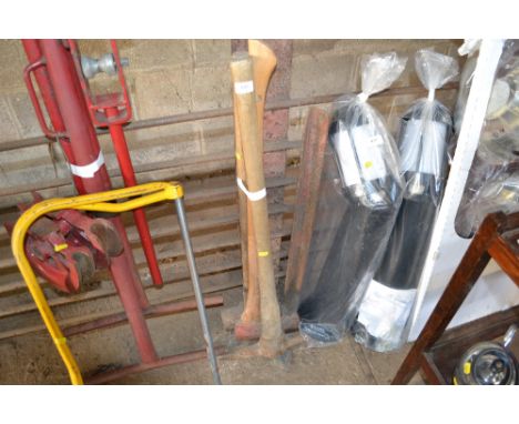 A pick axe; sledge hammer and an axe 