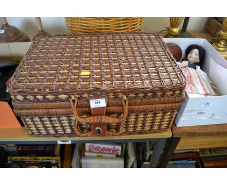 A wicker picnic hamper and part contents