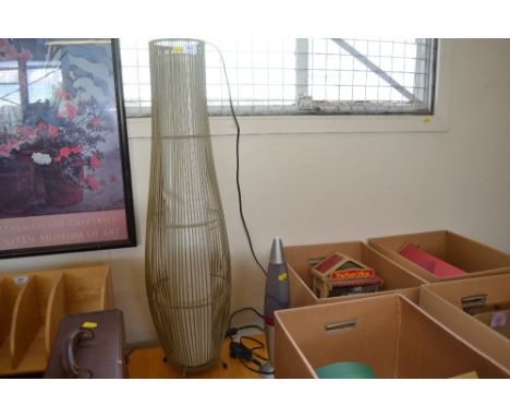 A wicker lamp together with a lava lamp