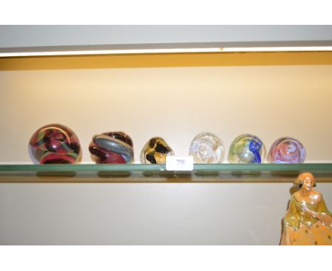 Six various Art Glass paperweights to include Caithness, Langham etc. 