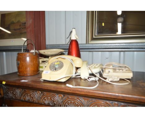 Three various telephones; a soda syphon; a set of kitchen scales; and an oak barrel 