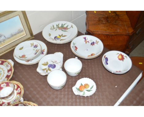 A quantity of Royal Worcester "Evesham" patterned china to include dinner plates, bowls, cups and saucers etc.