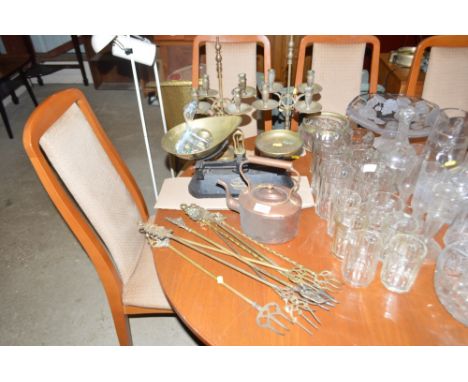A quantity of brass toasting forks; a copper kettle; a set of kitchen scales and a pair of brass candelabras 