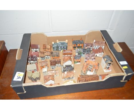 A collection of various pottery model houses
