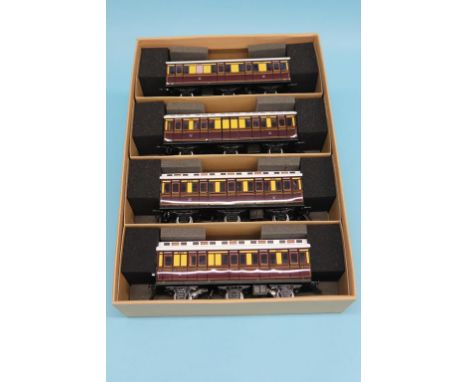 A boxed set of four Darstaed GWR railway coaches, a boxed Ace Trains Brake Van and two boxed sets of three tank wagons, vario