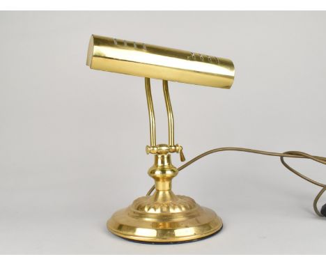 A Reproduction Brass Desktop Adjustable Lamp on Circular Base