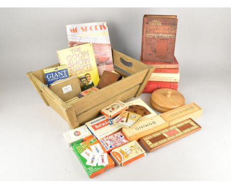 A Wooden Crate Containing Various Playing Cards, Dominoes, Cookery Books etc