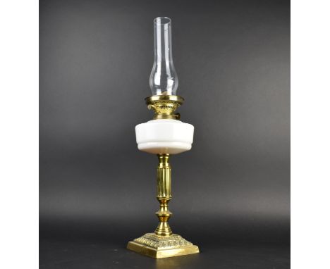 A Late Victorian Brass Based Oil Lamp with Opaque Milk Glass Reservoir, 64cms High