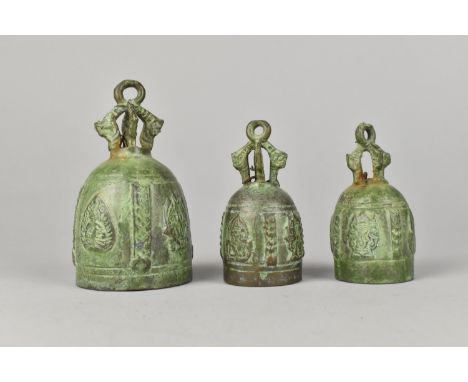A Set of Three Green Patinated Buddhist Bronze Handbells, Largest 11cms High, Pair 8cms High