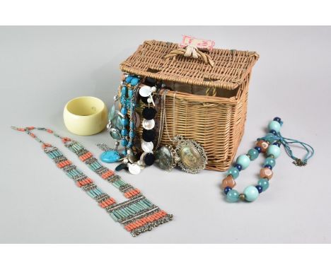 A Small Wicker Hamper Box Containing Various Costume Jewellery to include Necklaces, Bangles Etc
