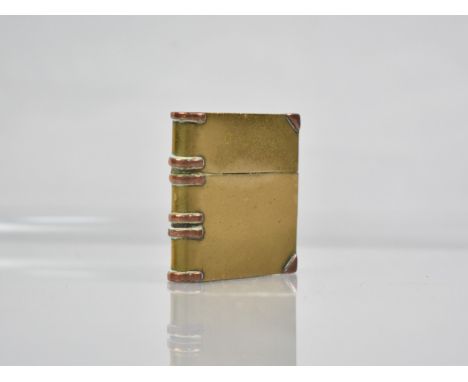 A Novelty Miniature Brass and Copper Lighter in the Form of a Leather Bound Book, 4cms High, (We Cannot Post This Lot)