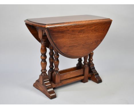 A Mid 20th Century Drop Leaf Oak Oval Topped Gate Leg Occasional/Coffee Table, 58cms Long and 50cms High