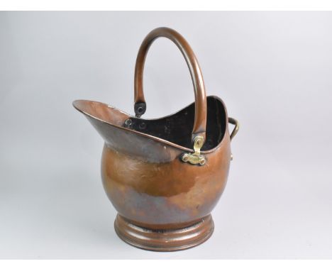 A Vintage Copper and Brass Helmet Shaped Coal Scuttle