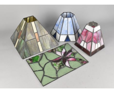 Three Tiffany Style table Lamp Shades and a Floral Decorated Coloured Glass Panel, 28x20cms