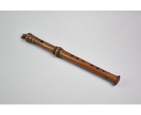 A Nepalese Flute with Brass and White Metal Inlay, 44cms Long