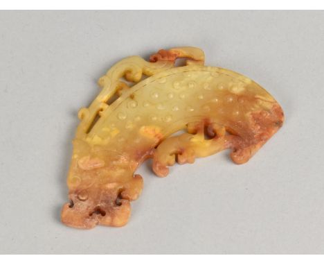 A Chinese Qing Dynasty White Jade and Rust Amulet, 10cms Long