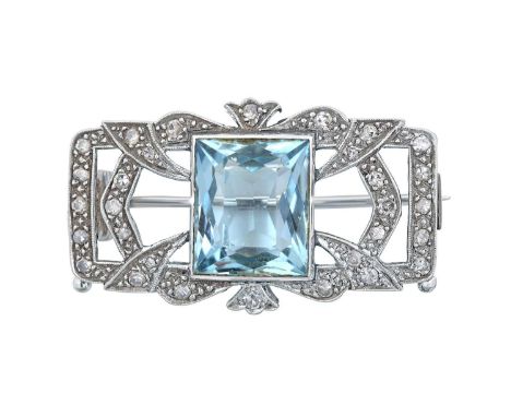An Aquamarine and Diamond Broochthe fancy cut aquamarine in a white rubbed over setting, to a openwork rectangular frame with