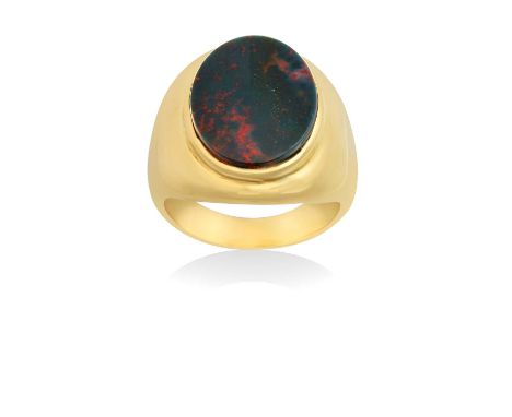 An 18 Carat Gold Bloodstone Signet Ringthe oval bloodstone plaque in a yellow rubbed over setting, to a tapered shoulder plai