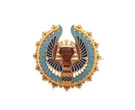 An Egyptian Revival Brooch the pharaoh with a carved hardstone face and wings enamelled throughout in navy and light blue, re