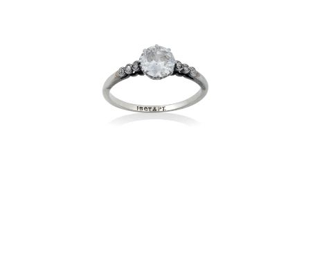 A Diamond Solitaire Ringthe round brilliant cut diamond in a white claw setting, to graduated eight-cut diamond set shoulders