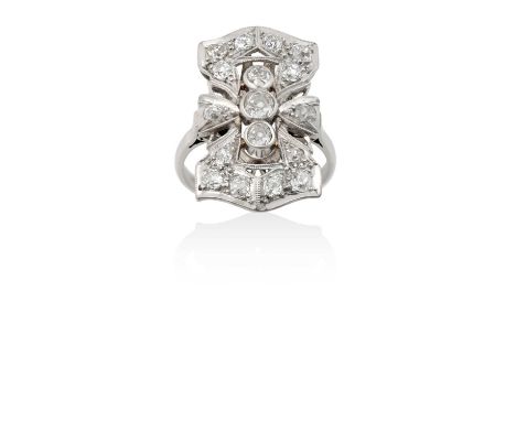 An Art Deco Style Diamond Cluster Ring three graduated old cut diamonds aligned up the finger, within a rectangular openwork 