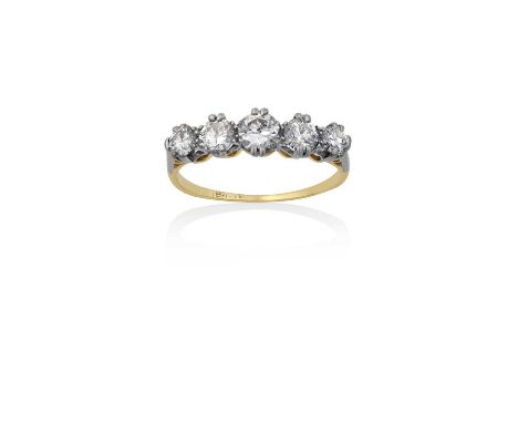 A Diamond Five Stone Ringthe graduated round brilliant cut diamonds in white double claw settings, to a yellow tapered should