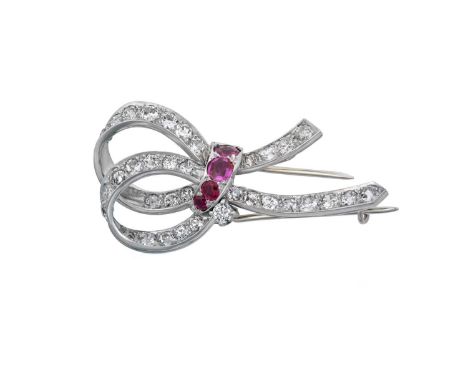 A Ruby and Diamond Broochrealistically modelled as a ribbon motif, set throughout with old cut diamonds and gathered centrall