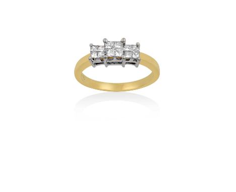A Diamond Triple Cluster Ringprincess cut diamonds arranged in three square clusters, in white claw settings, to a yellow tap