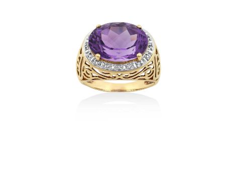An Amethyst and Diamond Cluster Ringthe oval cut amethyst in a yellow claw setting, within a border of eight-cut diamonds, in
