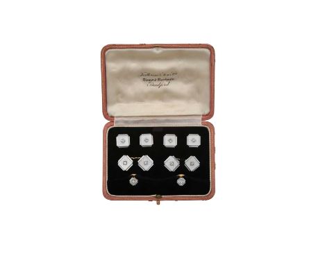 A Mother-of-Pearl and Diamond Dress Stud, Button and Cufflink Suite comprising of two dress studs, four buttons and a pair of