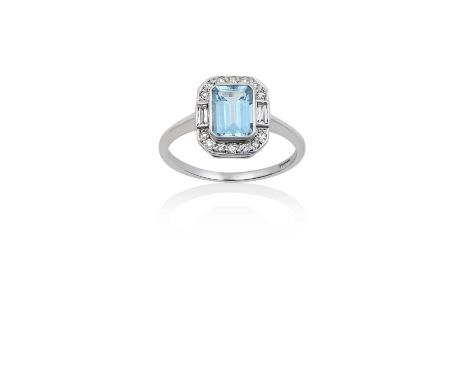 An Art Deco Style Aquamarine and Diamond Ringthe emerald-cut aquamarine within a border of eight-cut diamonds, with baguette 