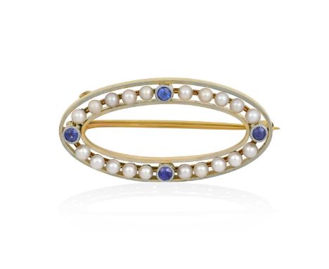 An Early 20th Century Sapphire and Pearl Broochthe white oval plain polished frame comprises pearls spaced by round cut sapph