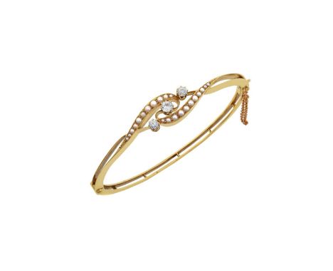 A Victorian Diamond and Split Pearl Hinged Banglethree graduated old cut diamonds, in yellow claw settings, to scroll shoulde