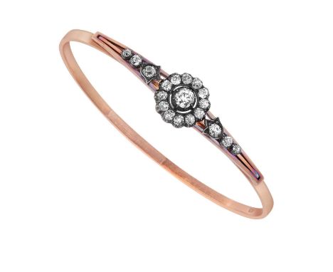 A Victorian Diamond Bangle the central old cut diamond within a border of smaller old cut diamonds, to a trio of graduated ol