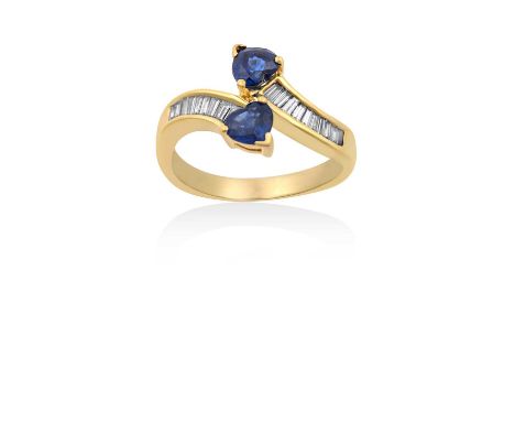 A Sapphire and Diamond Twist Ringthe yellow plain polished shank terminating to rows of tapered baguette cut diamonds and hea