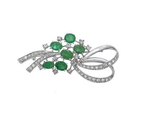 An Emerald and Diamond Broochthe ribbon spray motif set throughout with oval cut emeralds and round brilliant cut and eight-c