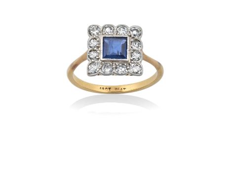 A Sapphire and Diamond Cluster Ringthe square step cut sapphire within a border of eight-cut diamonds, in white millegrain an
