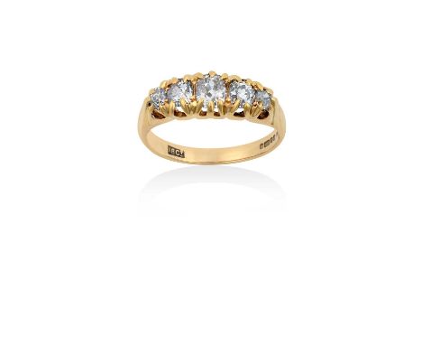 A 14 Carat Gold Diamond Five Stone Ringthe graduated old cut diamonds in yellow claw settings, to a plain polished shank, tot