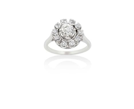 A Diamond Cluster Ringthe central raised old cut diamond within a border of smaller old cut diamonds, in white claw settings,