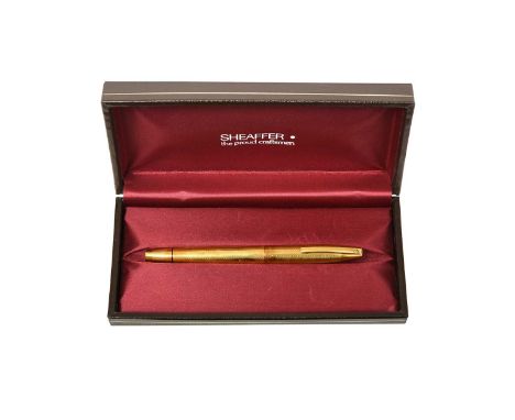 An Elizabeth II Gold Fountain-Pen,  by Sheaffer, London, 1972, 18ct with an engine-turned finish, engraved with initials, in 