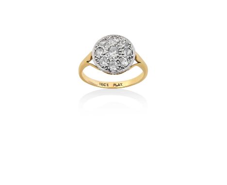 A Diamond Cluster Ringthe circular plaque set throughout with old cut diamonds, in white pavé settings, to a yellow forked sh
