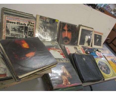A quantity of 1960's-1990's records, the sleeves being water damaged A/F to include Rolling Stones, 10cc and David Bowie and 