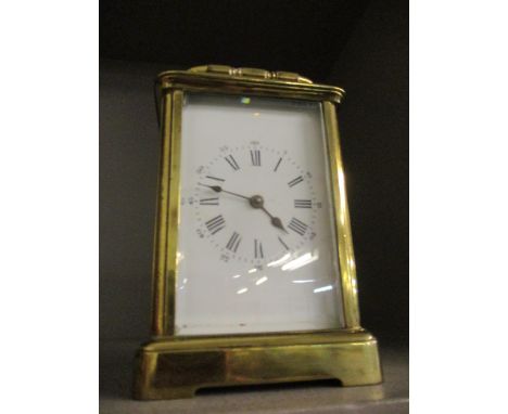 A late 19th century brass five-window carriage clock with enamelled dial and Roman numerals, with key Location: RWB 