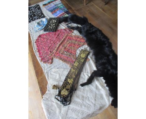 Mixed textiles and accessories from across the world to include a crocheted skull cap, an Eastern belt, circa 19th century, h