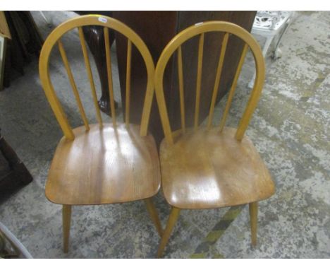 A pair of mid century retro Ercol elm and beech dining chairs 